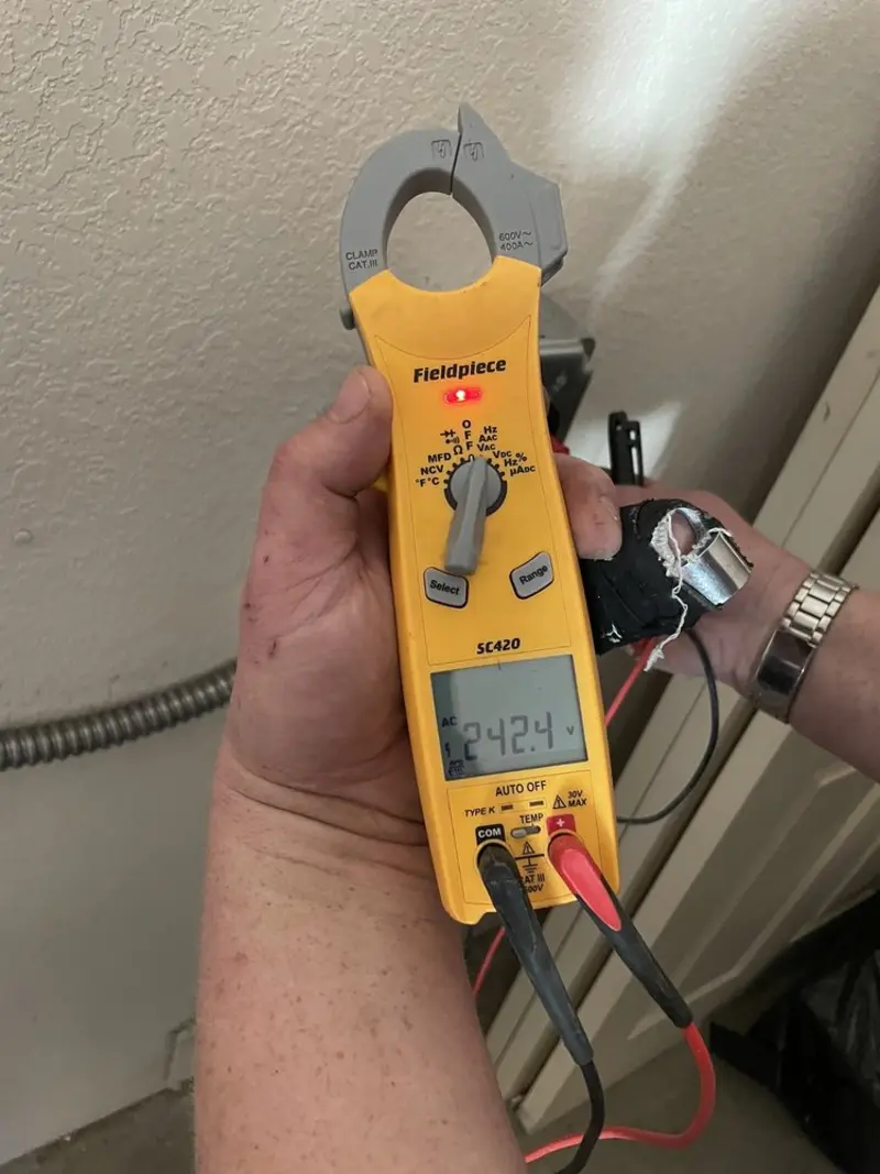 Voltage testing with clamp meter during Ceiling Fan Installation in Denver City